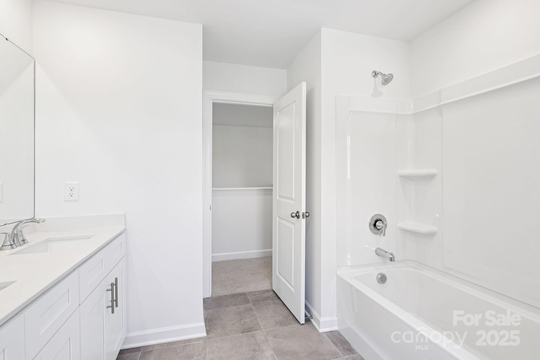 161 Murphy Mdw Road Mocksville, NC 27028 - Photo 15 of 29 a bathroom with a tub sink and mirror