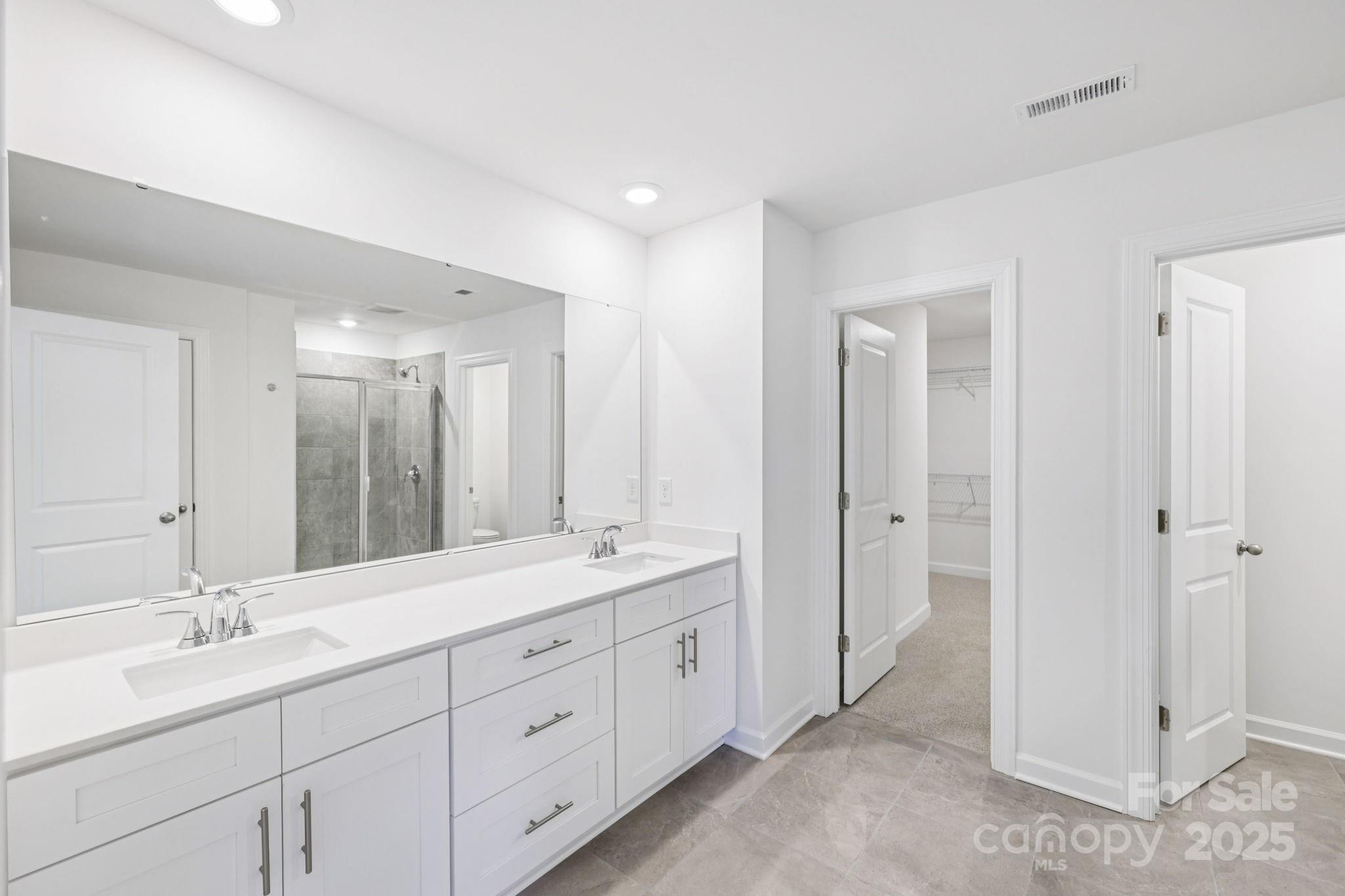 161 Murphy Mdw Road Mocksville, NC 27028 - Photo 24 of 29 a spacious bathroom with a double vanity sink mirror and double