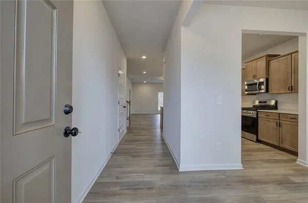 a view of a kitchen from the hallway