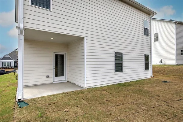 a view of a house with a backyard