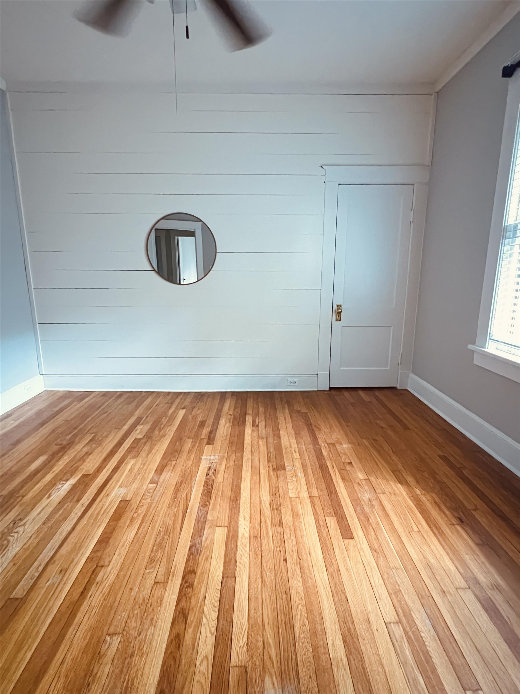 1925 Nelson Avenue Memphis, TN 38104 - Photo 22 of 39 Downstairs bedroom, hardwood floors, slat wall feature