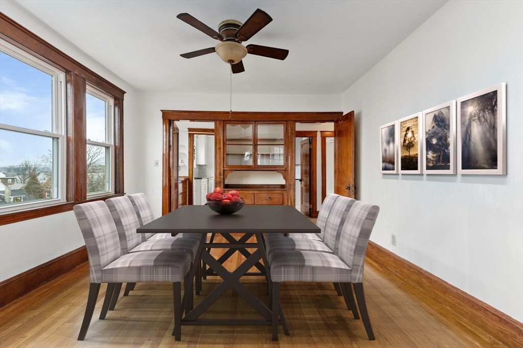 27 Union Street, Unit 3 Boston, MA 02135 - Photo 11 of 28 a dining room with furniture a rug and a large window