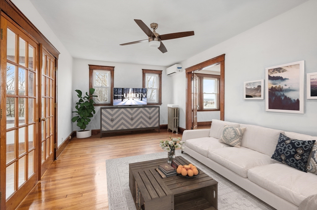 27 Union Street, Unit 3 Boston, MA 02135 - Photo 14 of 28 a living room with furniture and a large window