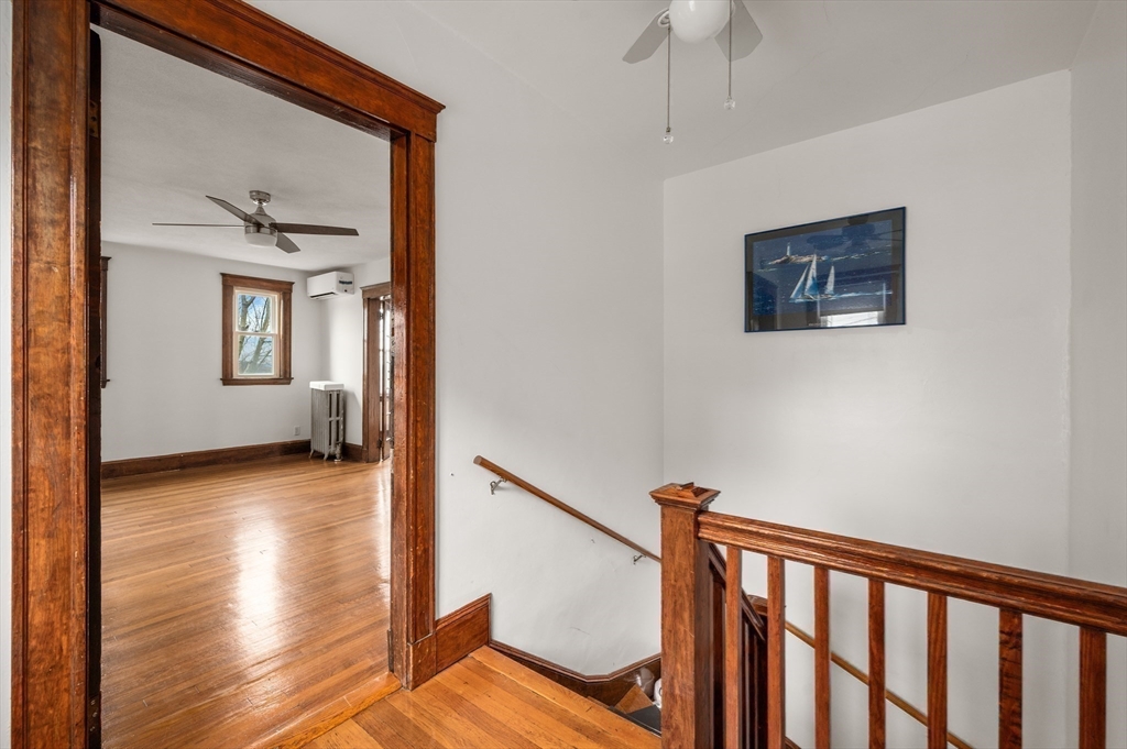 27 Union Street, Unit 3 Boston, MA 02135 - Photo 15 of 28 a view of a hallway with wooden floor and a living room
