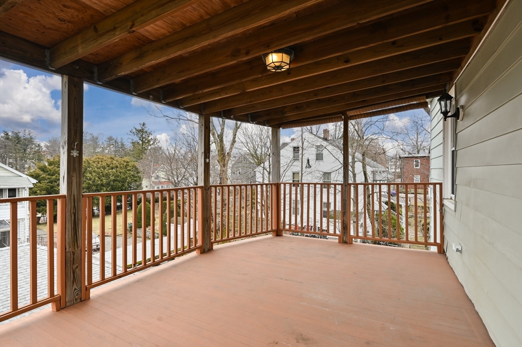 27 Union Street, Unit 3 Boston, MA 02135 - Photo 25 of 28 a view of porch with green trees in front of it