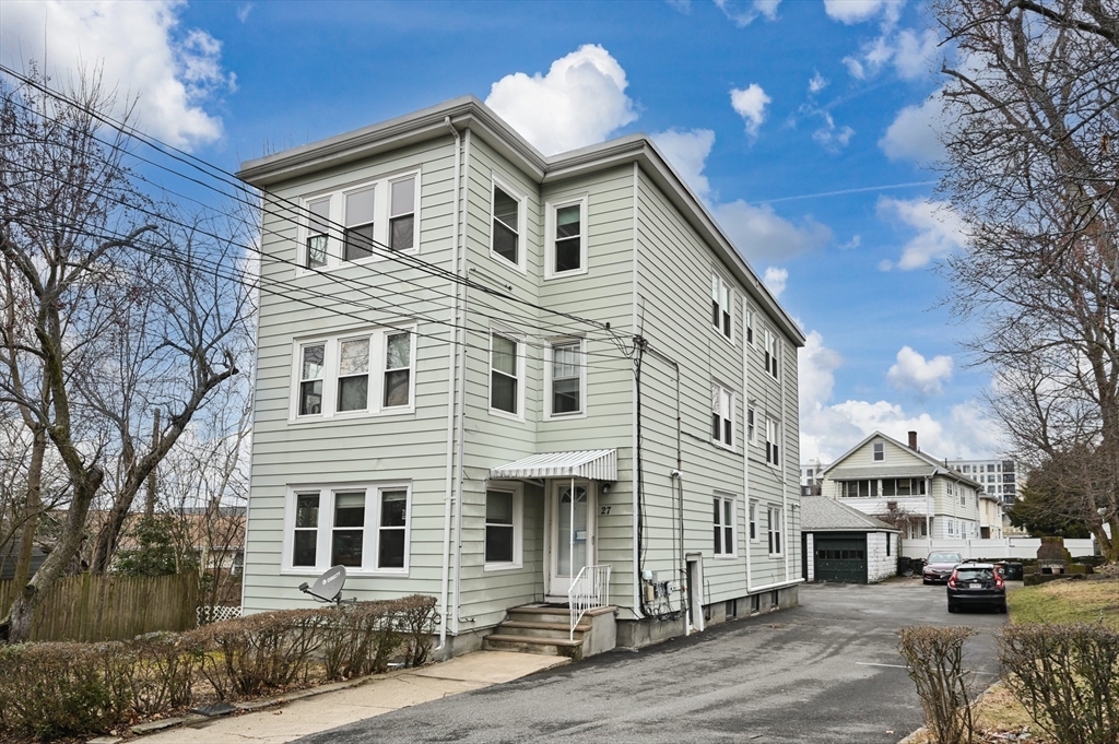27 Union Street, Unit 3 Boston, MA 02135 - Photo 28 of 28 a view of a white building among the street with houses