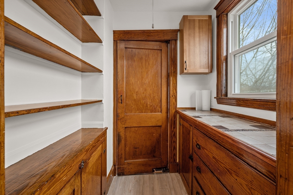 27 Union Street, Unit 3 Boston, MA 02135 - Photo 6 of 28 a kitchen with a sink and a refrigerator