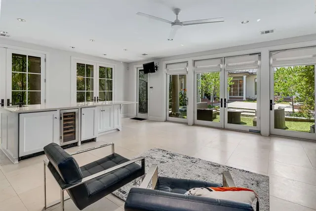 a living room with furniture and windows