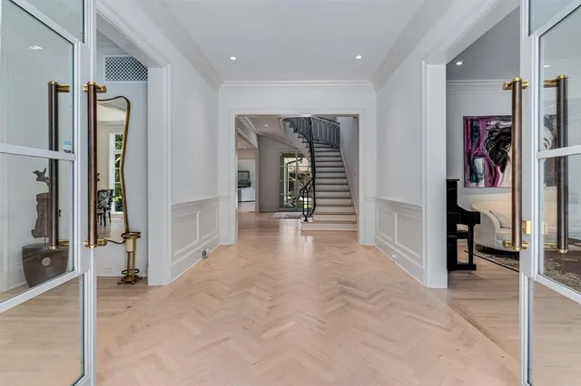 a view of a hallway with wooden shelves