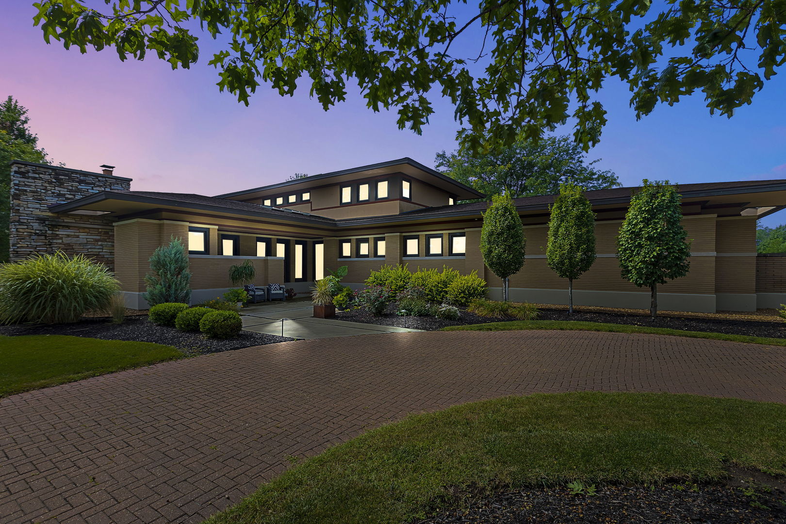 a front view of a house with garden