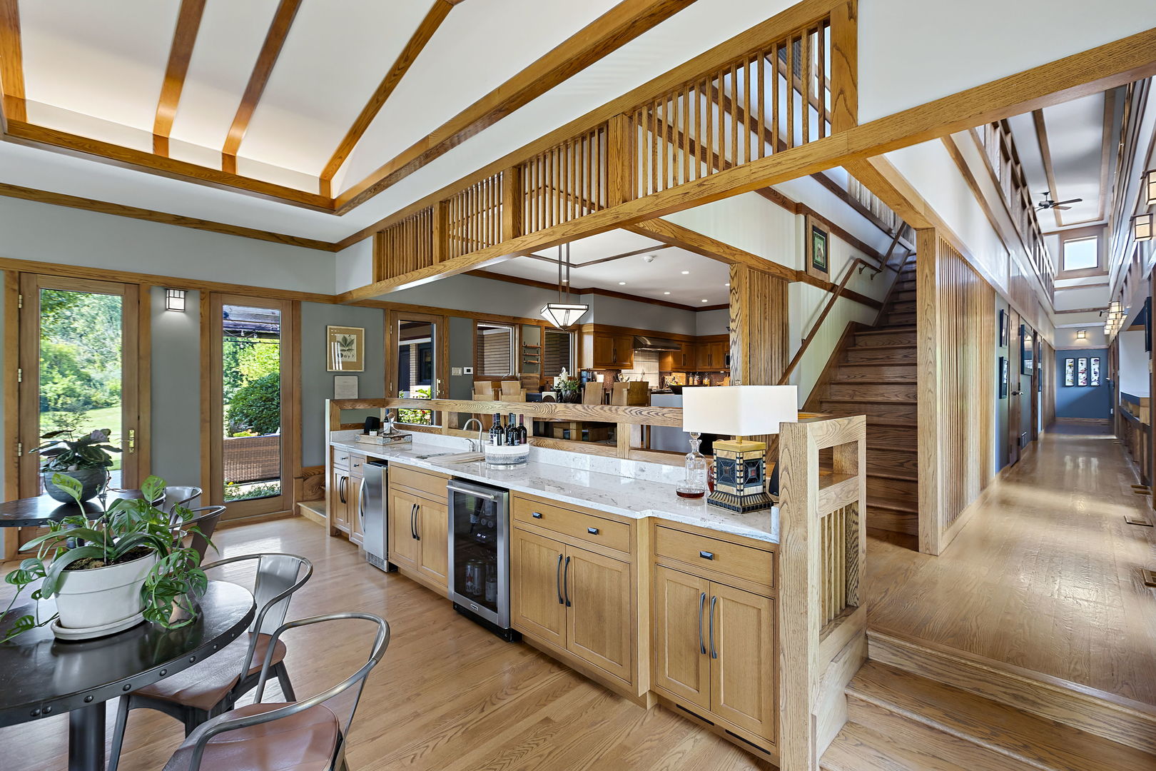 13540 McCarthy Road Lemont, IL 60439 - Photo 13 of 71 a kitchen with stainless steel appliances kitchen island granite countertop a table chairs in it and wooden floors