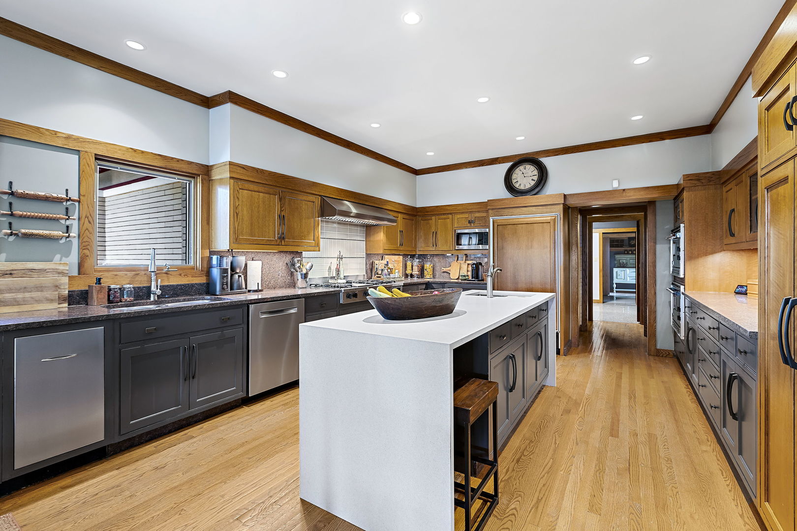 13540 McCarthy Road Lemont, IL 60439 - Photo 17 of 71 a kitchen with stainless steel appliances granite countertop a sink a stove and a wooden floors