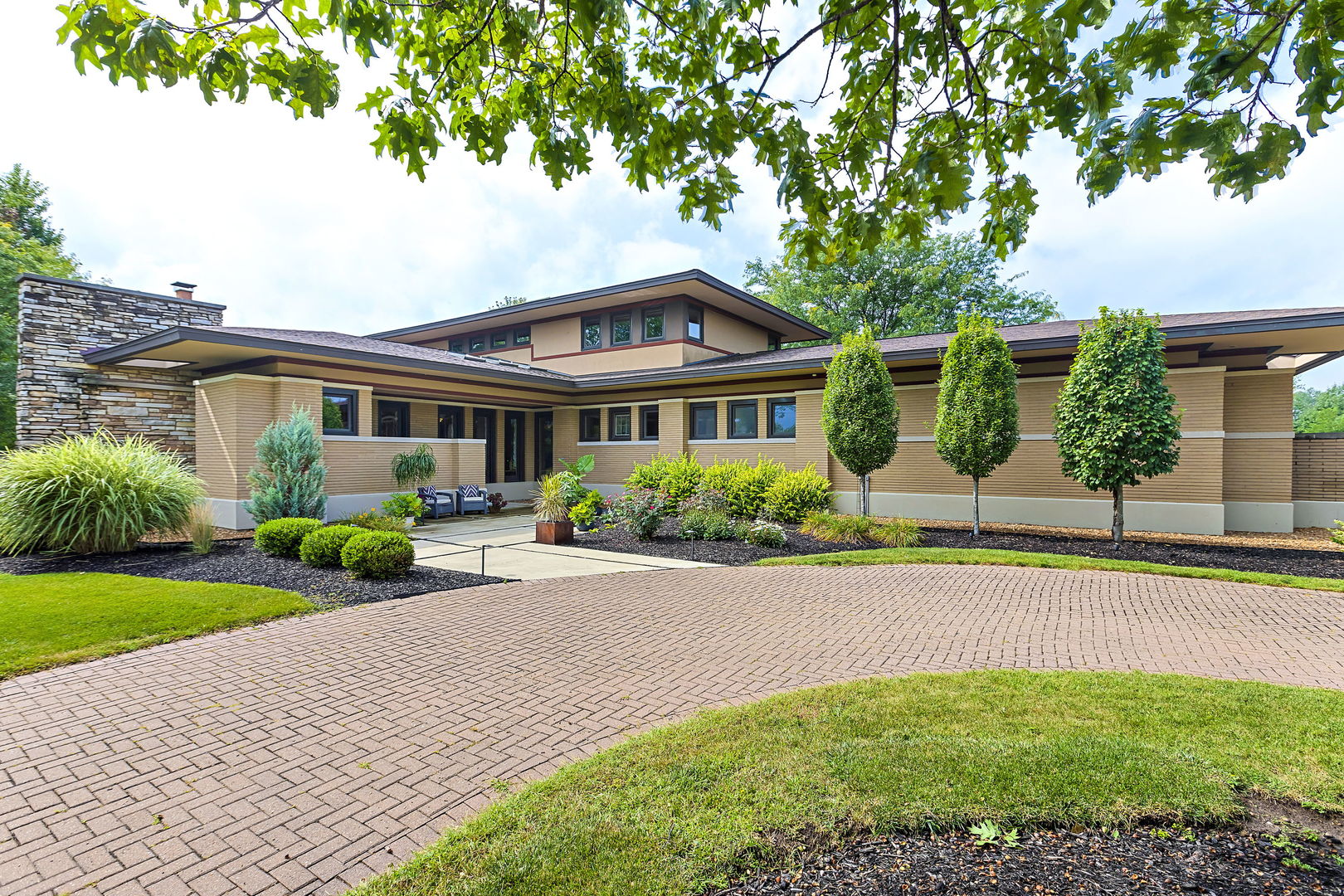 13540 McCarthy Road Lemont, IL 60439 - Photo 2 of 71 a front view of a house with a yard and potted plants