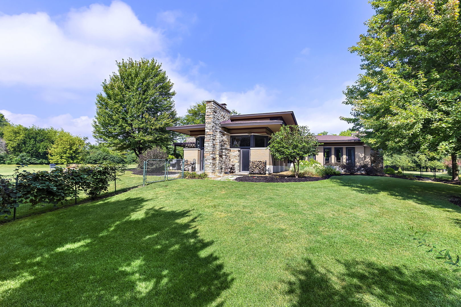 13540 McCarthy Road Lemont, IL 60439 - Photo 45 of 71 a view of a house with backyard and a sitting area