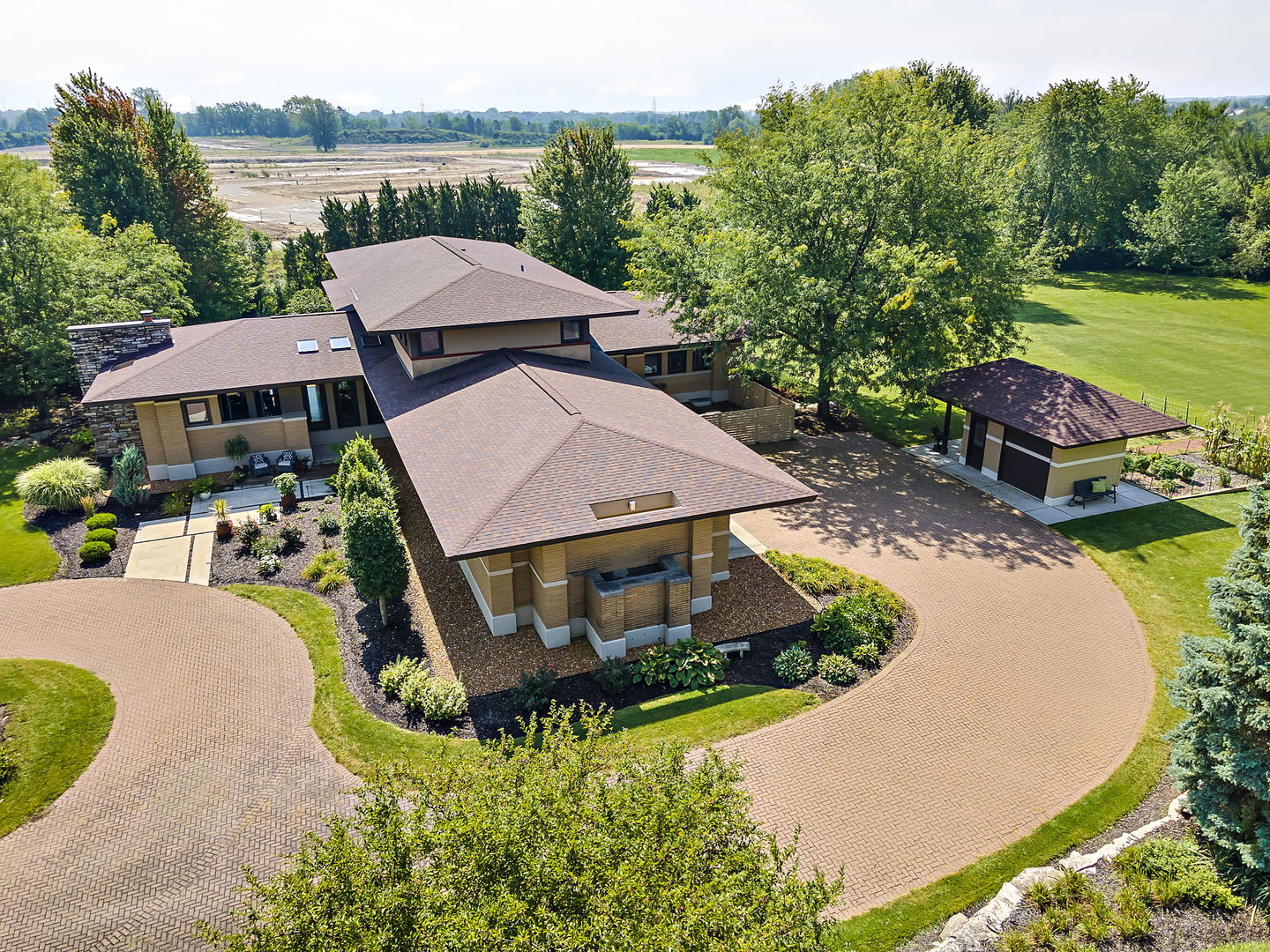 13540 McCarthy Road Lemont, IL 60439 - Photo 52 of 71 an aerial view of a house with swimming pool and garden