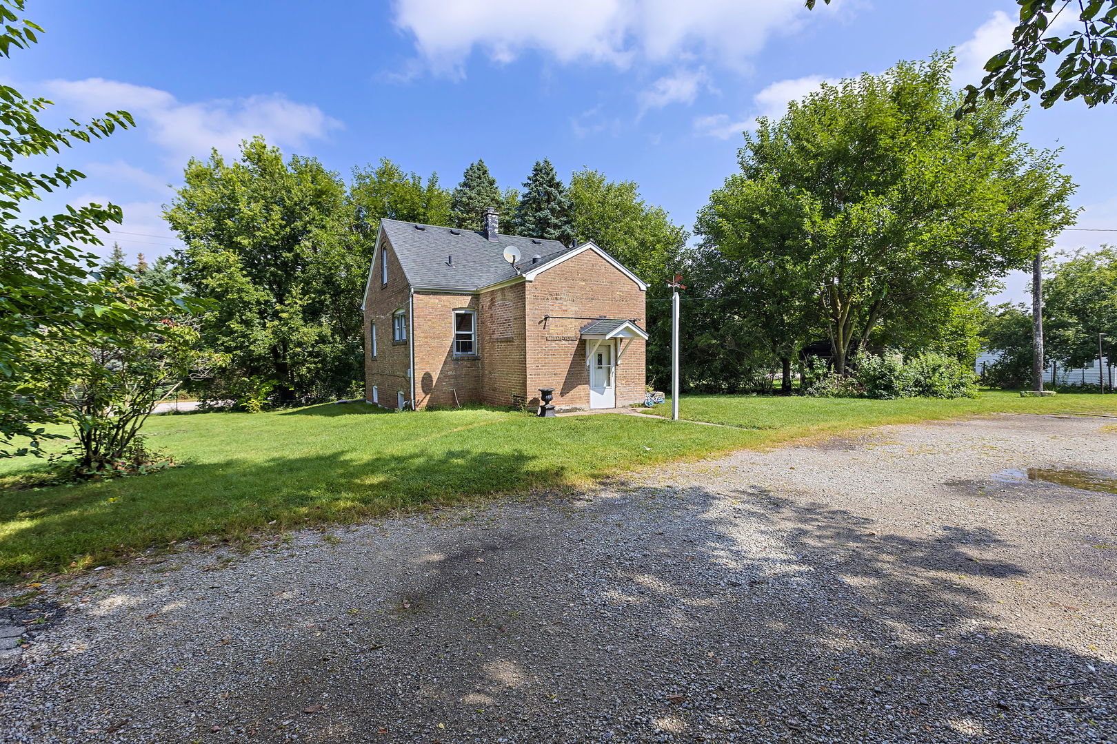 13540 McCarthy Road Lemont, IL 60439 - Photo 8 of 71 a view of a house with a big yard and large trees