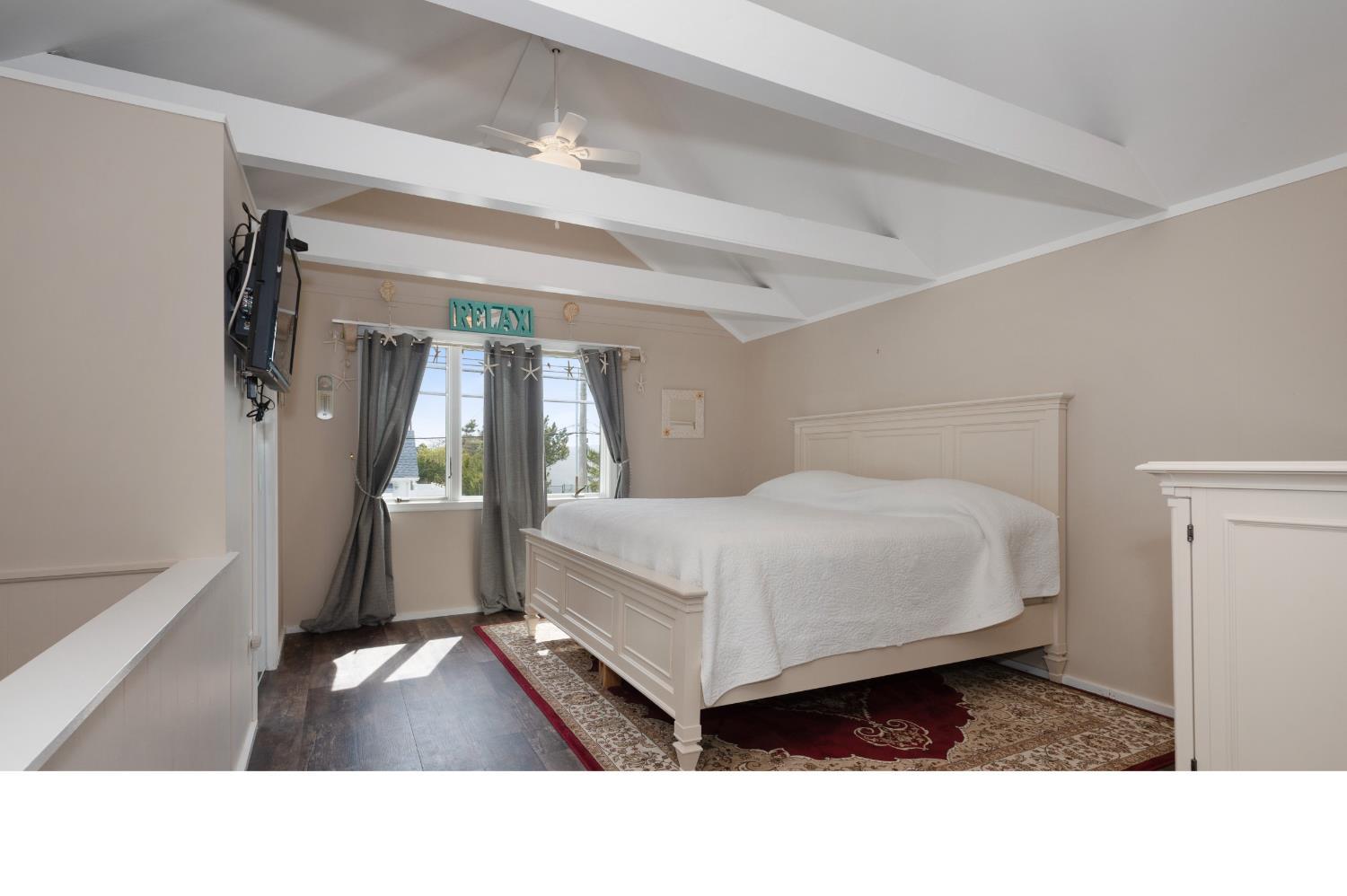 347 Highway 35 Mantoloking, NJ 08738 - Photo 4 of 5 a living room with a bed furniture and a window