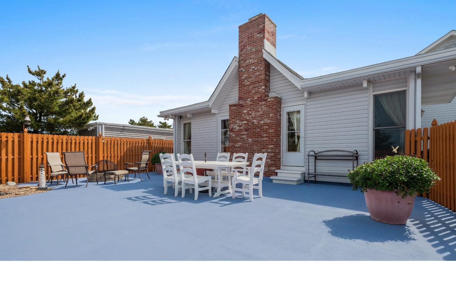 347 Highway 35 Mantoloking, NJ 08738 - Photo 5 of 5 a backyard of a house with table and chairs