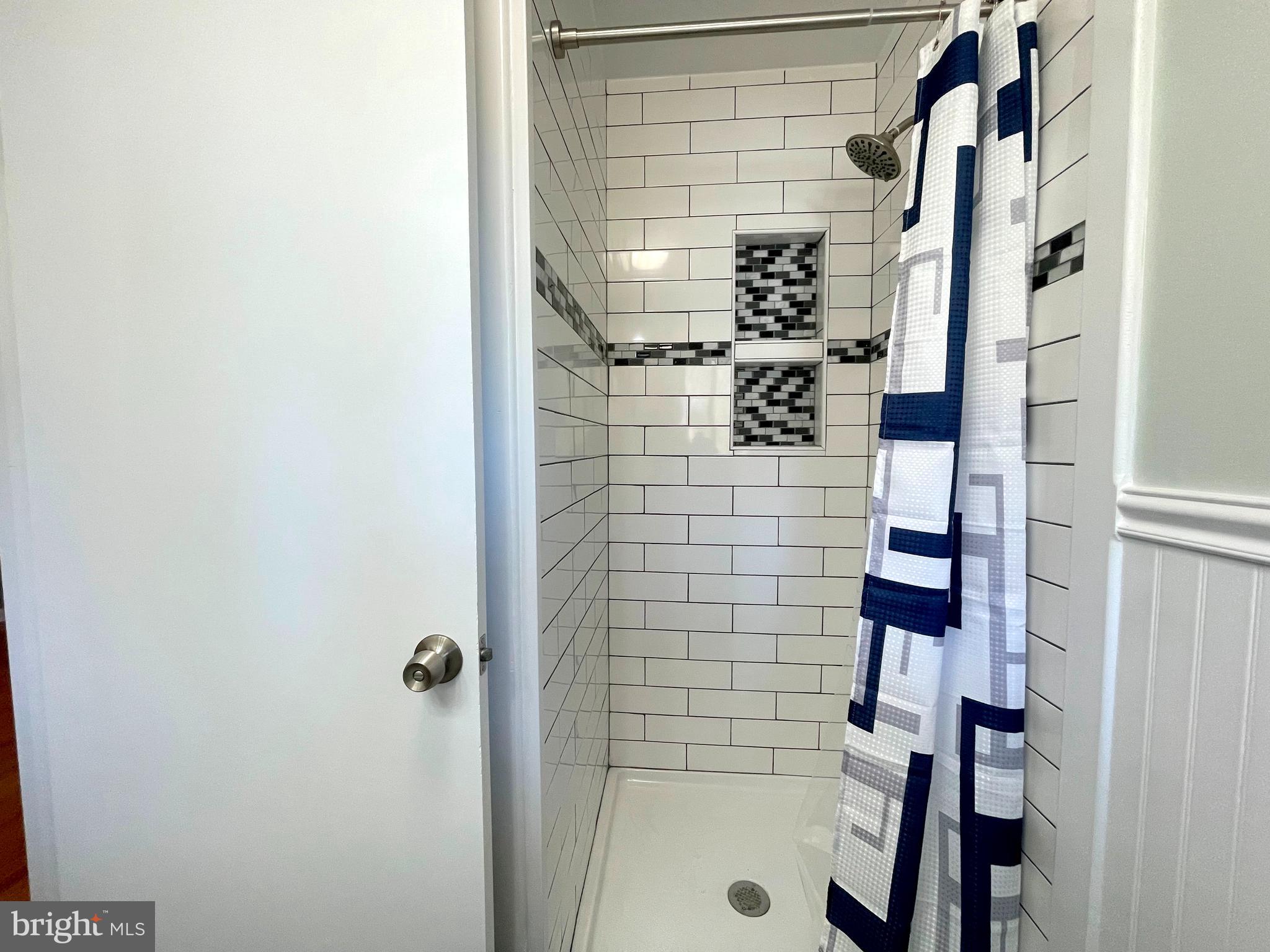 9457 Boyds Turn Road Owings, MD 20736 - Photo 25 of 46 a bathroom with a shower