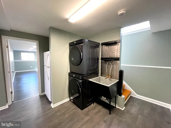 a room with wooden floor and furniture