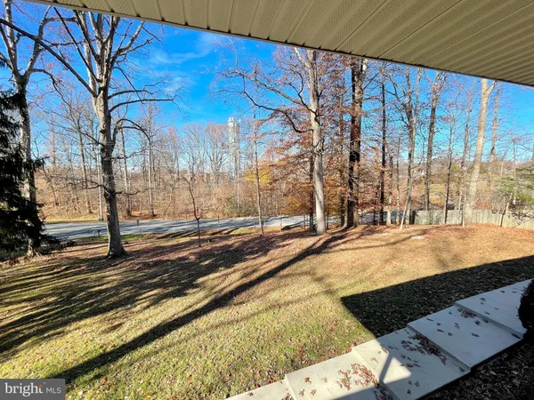 a view of a backyard of the house