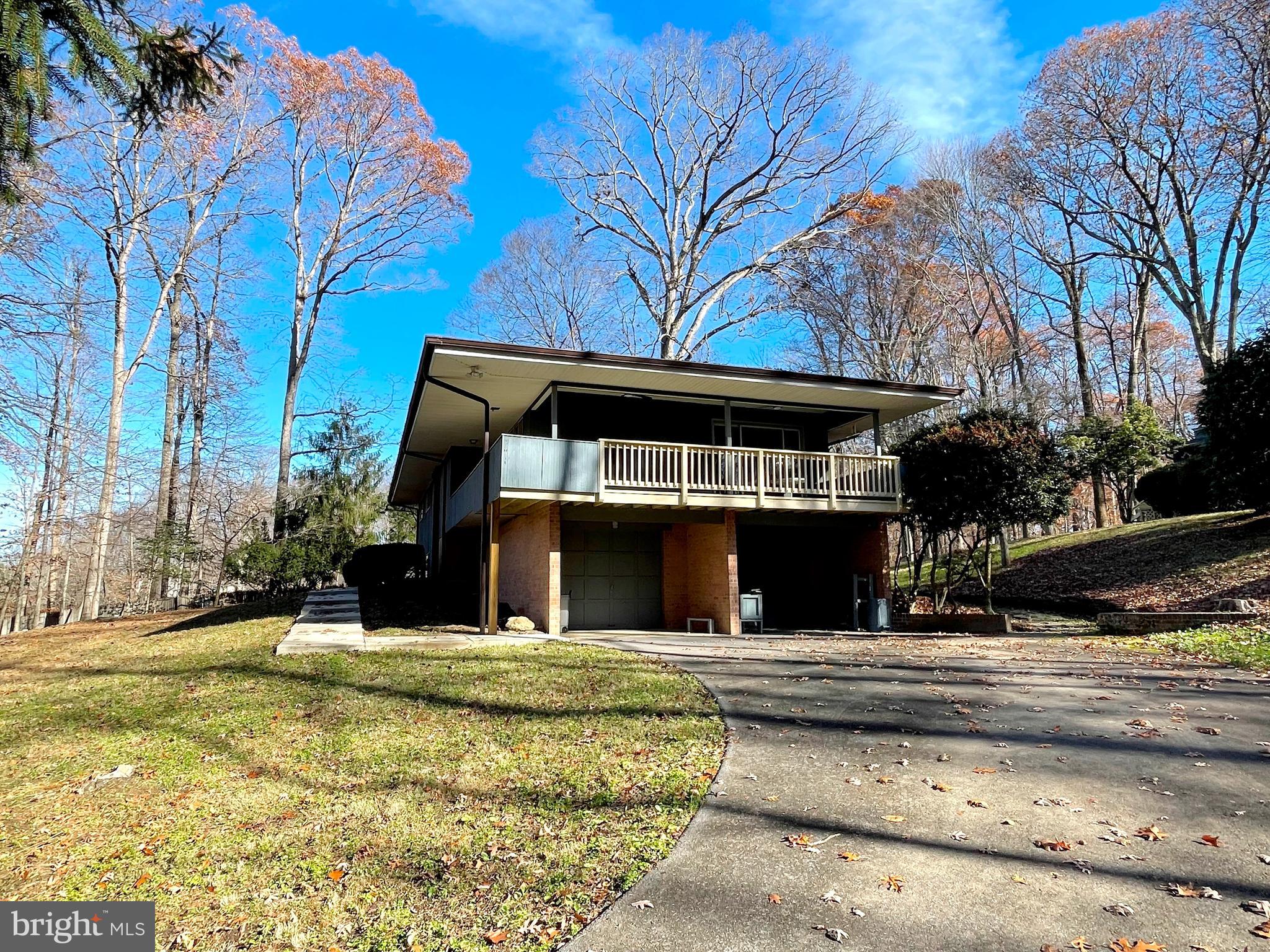 9457 Boyds Turn Road Owings, MD 20736 - Photo 37 of 46 a view of a building with a large tree