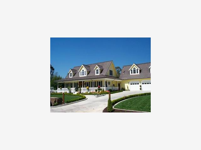 a picture of a bench in front of a building