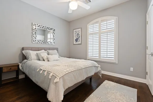 a bedroom with bed and a window