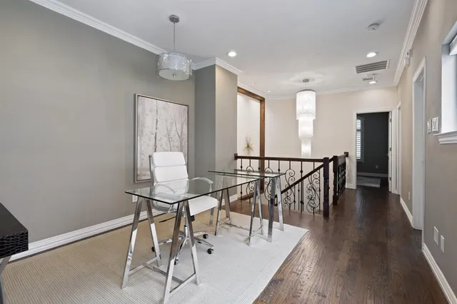 a view of a room with wooden floor and windows