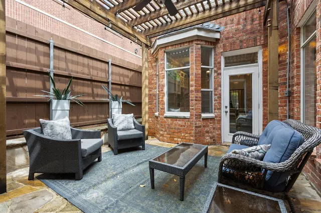 a outdoor living space with patio furniture and a potted plant