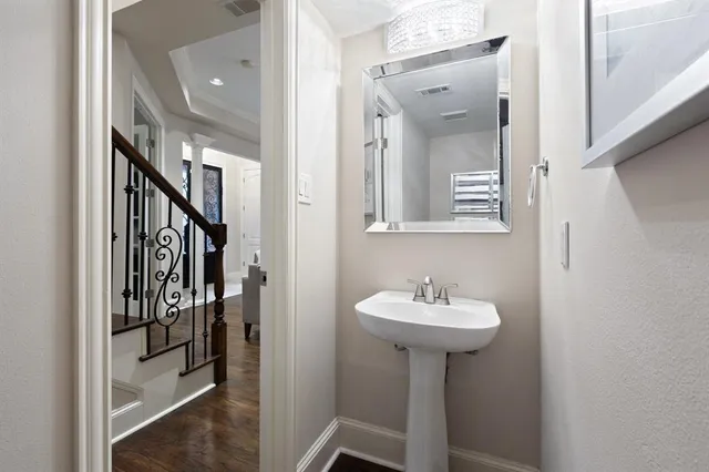 a bathroom with a sink a mirror and a shower