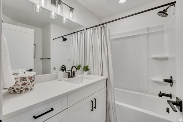 330 East 7635 S Street Sandy, UT 84047 - Photo 16 of 29 Full bathroom with vanity, shower / bath combination with curtain, and recessed lighting