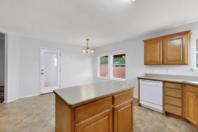a kitchen with a stove and a sink