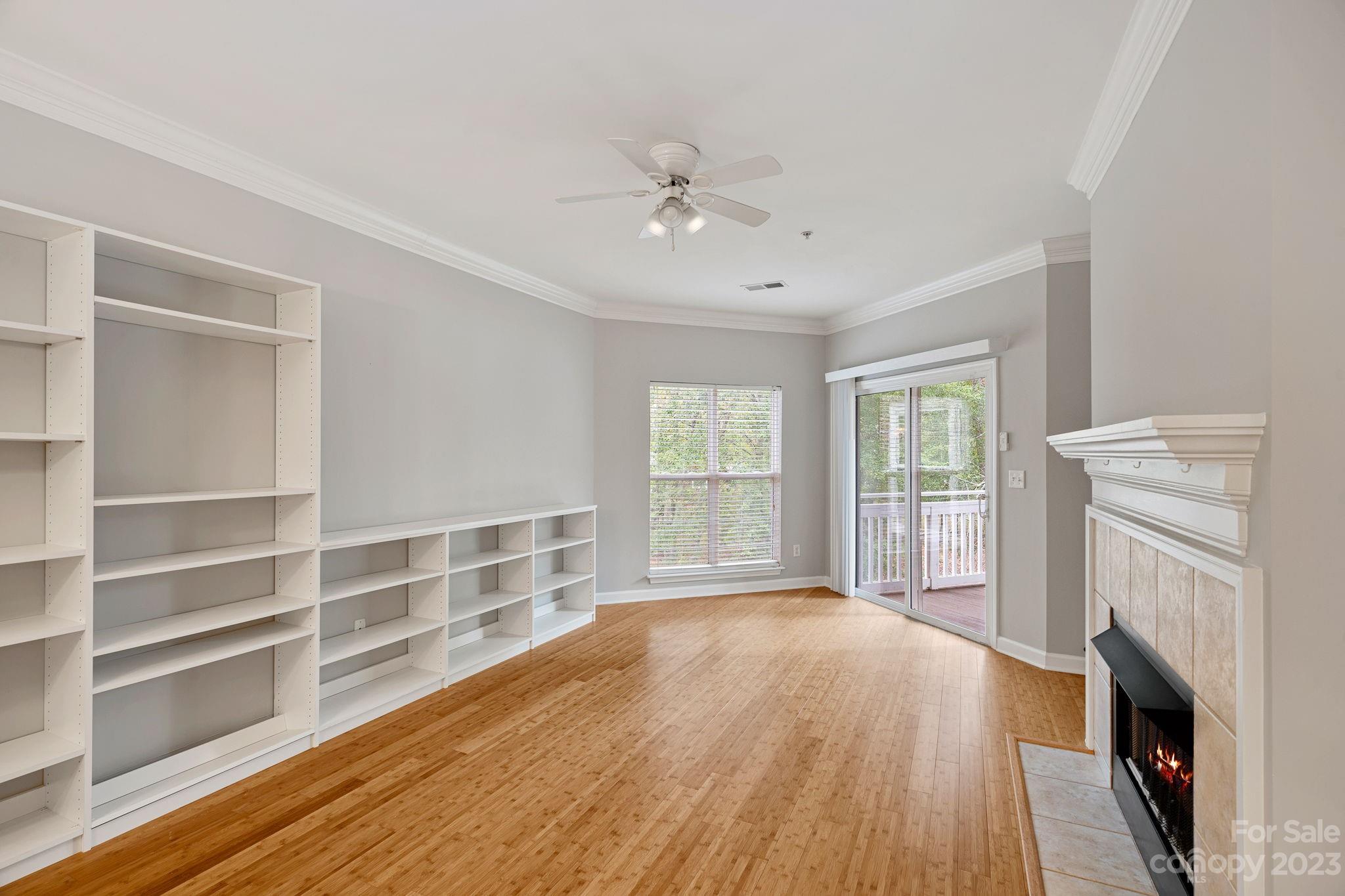 747 Peninsula Drive Davidson, NC 28036 - Photo 21 of 31 a view of an empty room with a window and fireplace
