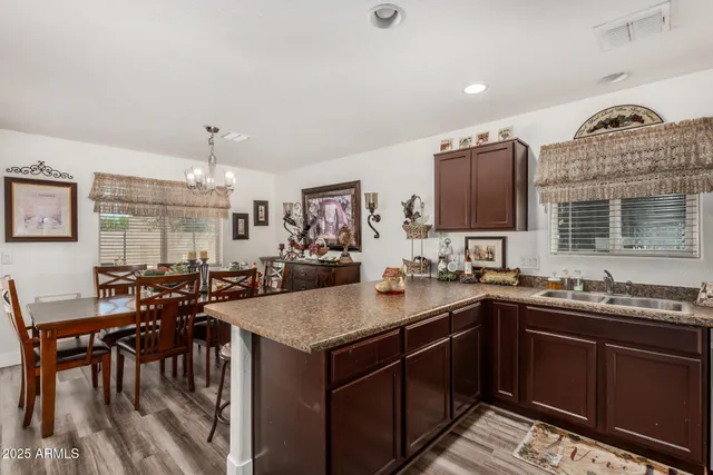 a kitchen with lots of counter top space and dining table