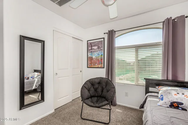 a livingroom with workspace and a window