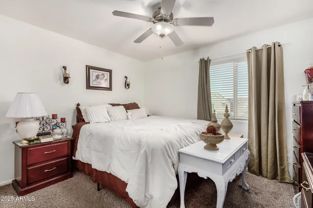 a bedroom with a bed and a dresser