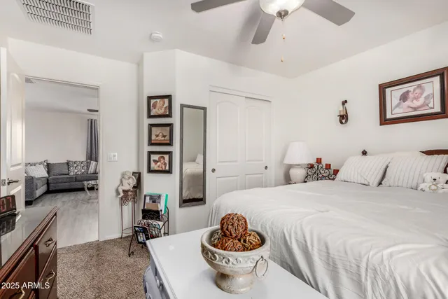 a bedroom with a bed and a couch