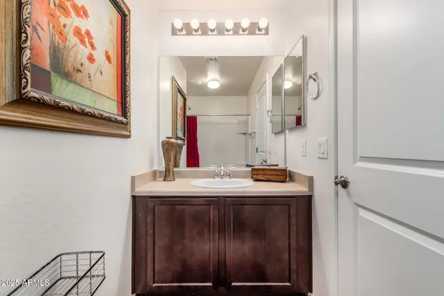 a bathroom with a sink and mirror