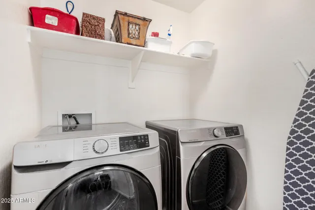 a utility room with dryer and washer