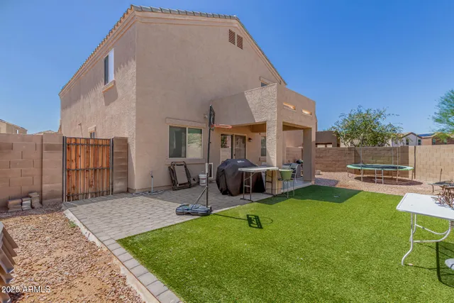 a backyard of a house with seating space