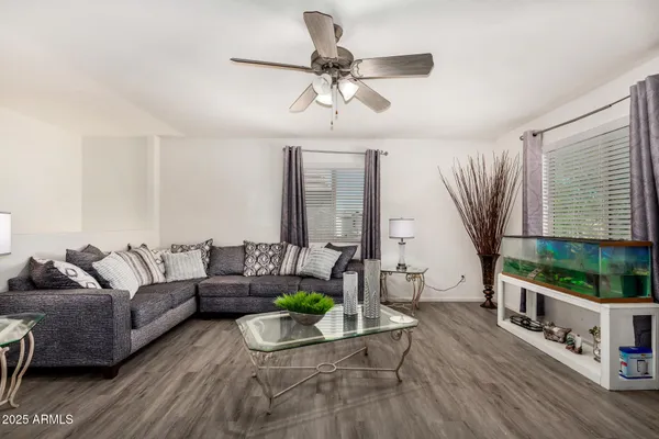 a living room with furniture and a large window