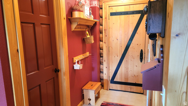 6210 Mountain View Road, Unit 133 Coalville, UT 84017 - Photo 34 of 87 Coat racks, ornamental shelf & door to the full bath.