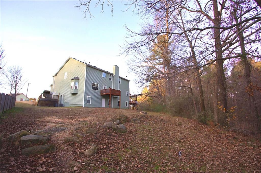 6074 Locklear Way Douglasville, GA 30134 - Photo 11 of 12 a view of a house with a yard