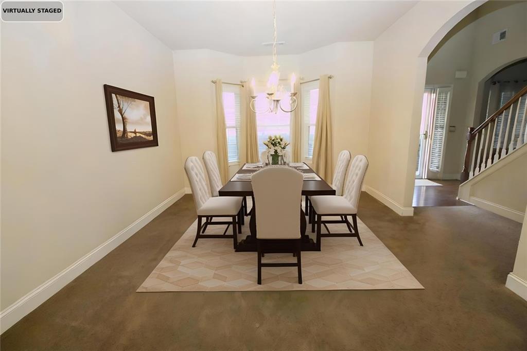 6074 Locklear Way Douglasville, GA 30134 - Photo 4 of 12 a dining room with furniture and wooden floor