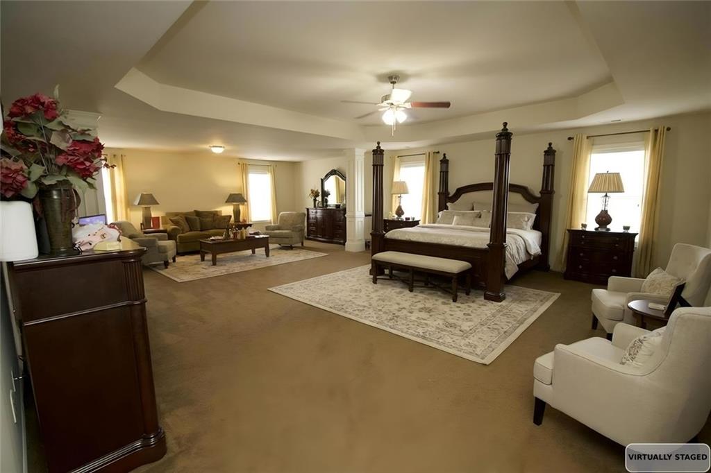 6074 Locklear Way Douglasville, GA 30134 - Photo 5 of 12 a living room with furniture and a chandelier