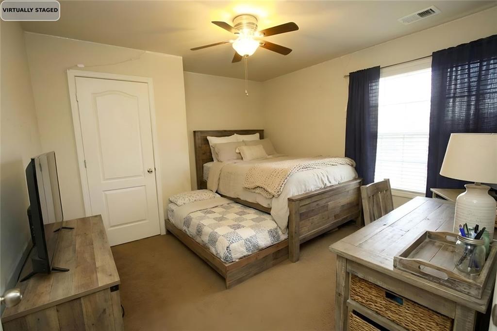 6074 Locklear Way Douglasville, GA 30134 - Photo 9 of 12 a bedroom with bed and window