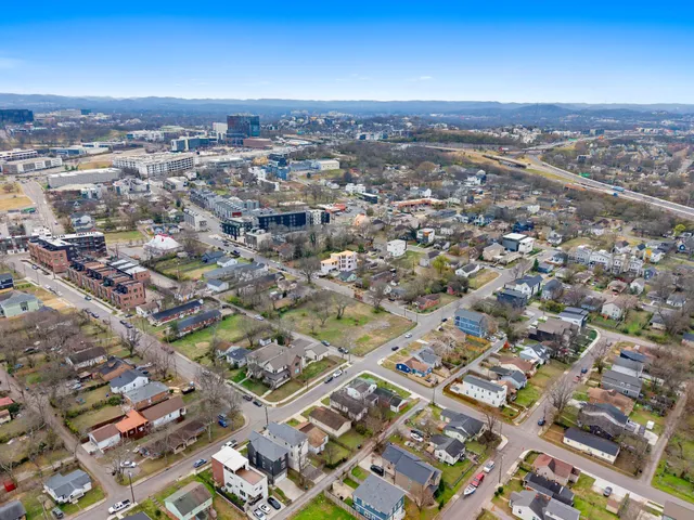 an aerial view of residential building with parking space