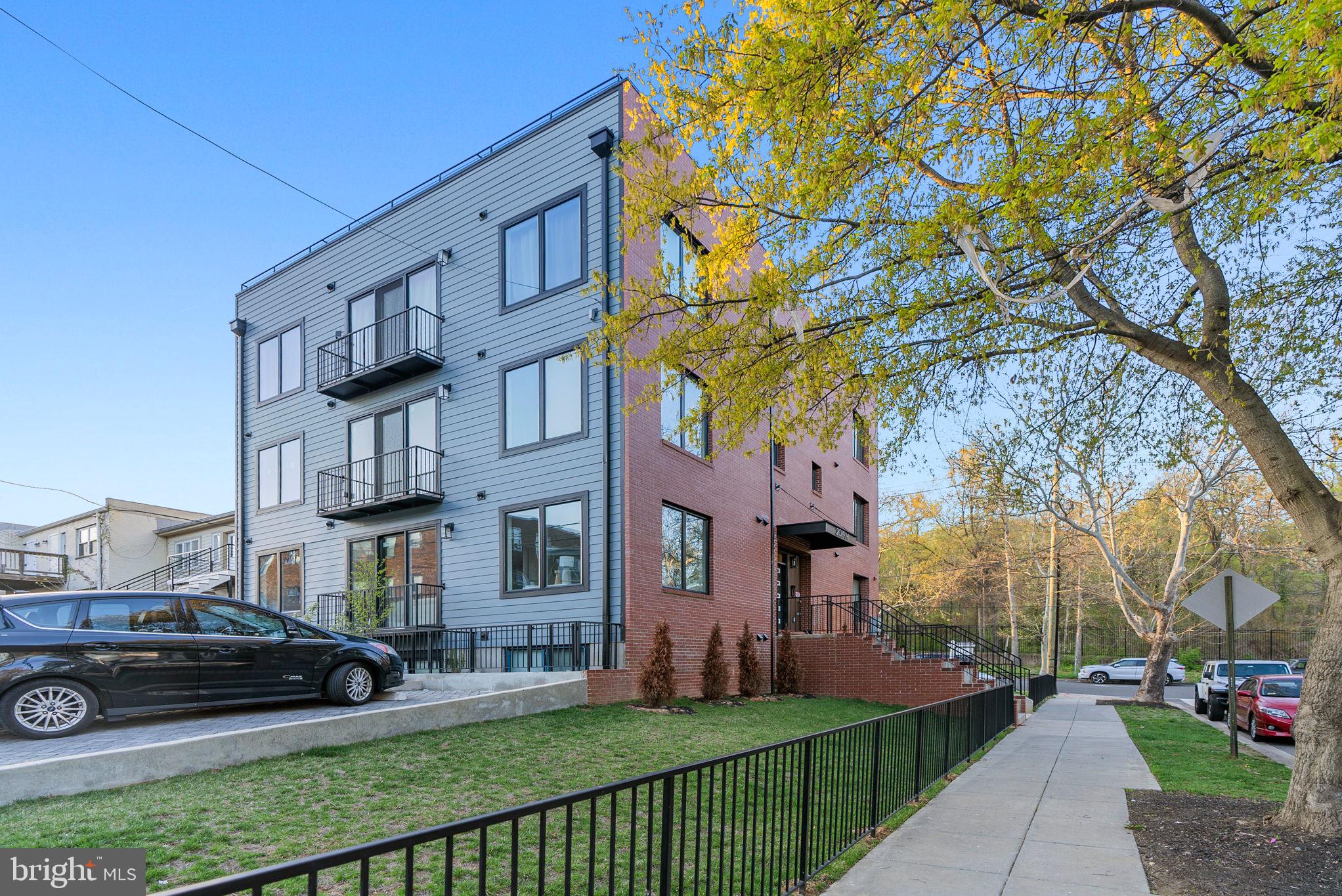 2019 M Street Northeast, Unit 1 Washington, DC 20002 - Photo 31 of 31 a view of a building with a yard