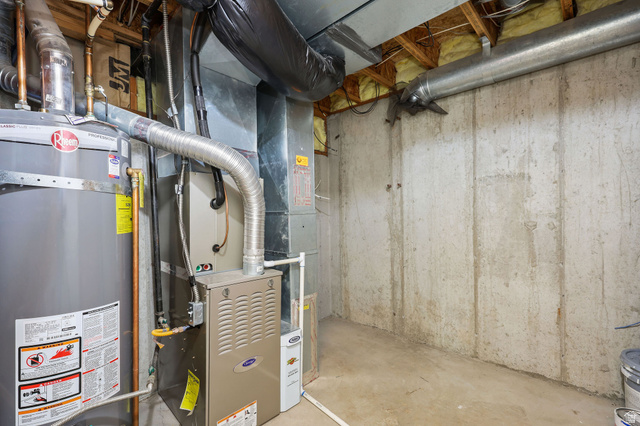 142 East 2675th Street South Clearfield, UT 84015 - Photo 33 of 49 Utility area featuring a water heater, furnace, exposed ductwork, concrete flooring, and concrete foundation walls